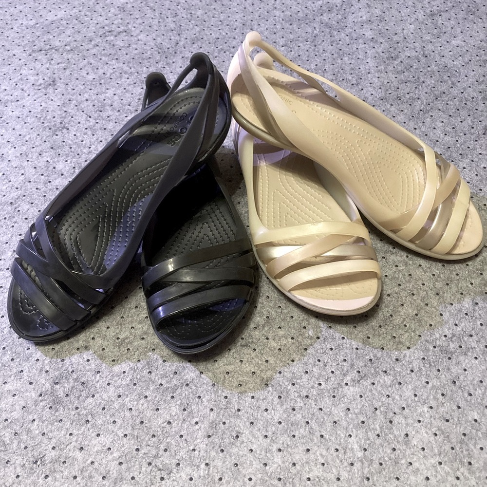 2 pairs of crocs sandals size 7 standard fit.